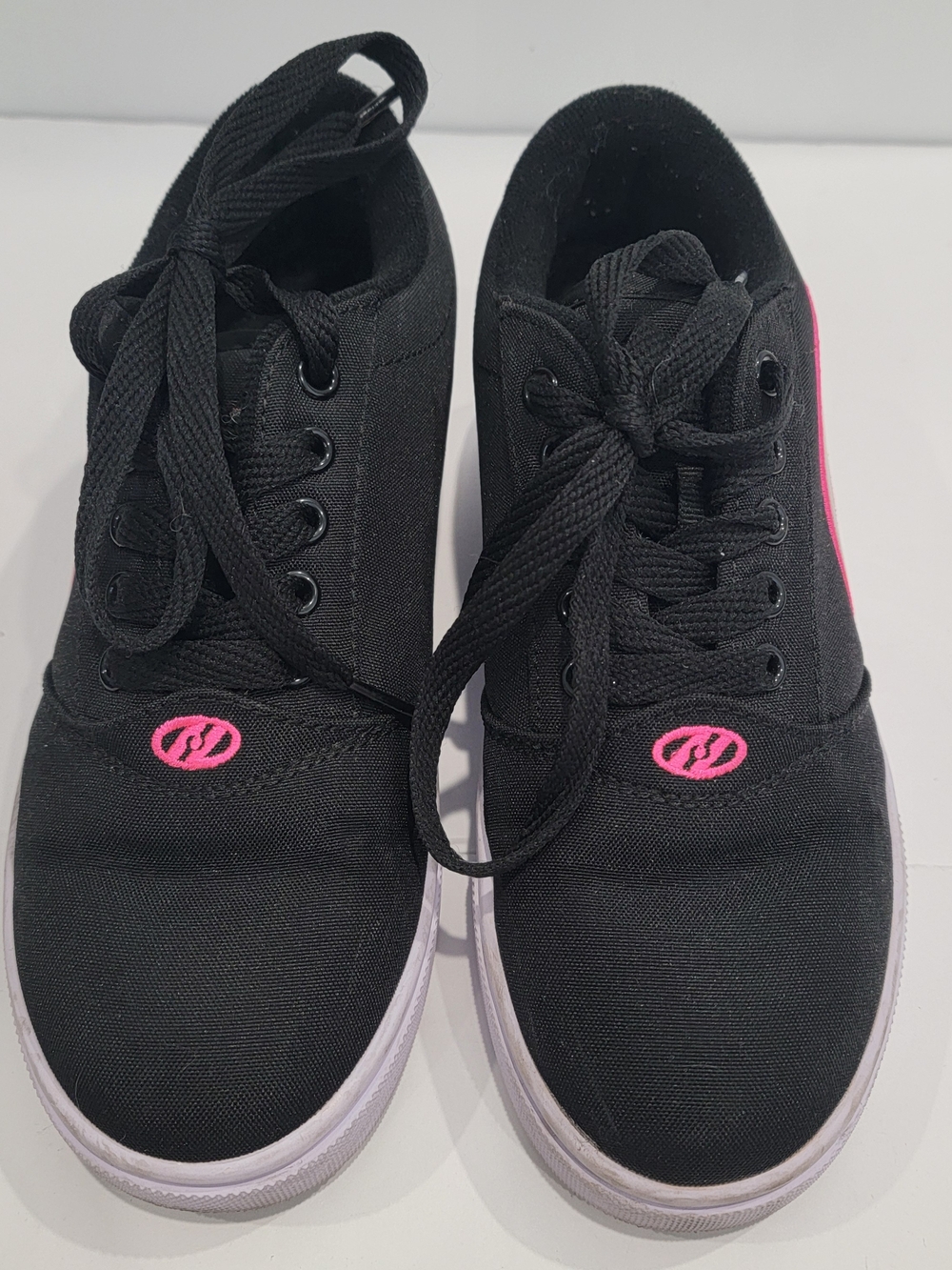 black & pink Heelys roller shoes